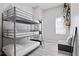 Efficiently designed bedroom with triple bunk beds, seating and modern decor at 514 English Nw Ave, Atlanta, GA 30318