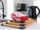 The kitchen features wooden cutting boards, stylish oven mitts, and a sleek electric kettle at 514 English Nw Ave, Atlanta, GA 30318
