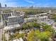 The aerial view highlights nearby city views, trees, and residential buildings at 650 Somerset Ne Ter, Atlanta, GA 30306