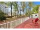 View of the spacious backyard from the back deck with seating and mature trees at 650 Somerset Ne Ter, Atlanta, GA 30306