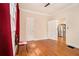 Bedroom with hardwood flooring with views to the kitchen and neutral paint at 650 Somerset Ne Ter, Atlanta, GA 30306