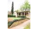 Quaint bungalow with lush landscaping, brick paver path, and covered front porch at 650 Somerset Ne Ter, Atlanta, GA 30306