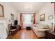 Bright living room featuring hardwood floors, large windows, fireplace and neutral paint at 650 Somerset Ne Ter, Atlanta, GA 30306