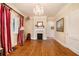 Spacious living room with hardwood floors, fireplace, and decorative chandelier at 650 Somerset Ne Ter, Atlanta, GA 30306