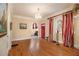 Bright living room features hardwood floors, fireplace, and stained glass windows at 650 Somerset Ne Ter, Atlanta, GA 30306
