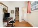 Home office featuring a desk, bookshelves, and warm hardwood floors at 650 Somerset Ne Ter, Atlanta, GA 30306