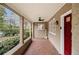 Welcoming front porch with brick flooring, classic columns, and stylish ceiling fan at 650 Somerset Ne Ter, Atlanta, GA 30306