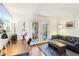 Living room with hardwood floors, sofa, desk, and French doors at 1355 Euclid Ne Ave # B24, Atlanta, GA 30307