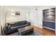 Living room featuring hardwood floors, sofa, and built in shelving at 1355 Euclid Ne Ave # B24, Atlanta, GA 30307