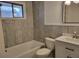 Bright bathroom with tub, decorative tile, modern vanity and mirror at 136 Peachtree Memorial Nw Dr # Ga8, Atlanta, GA 30309