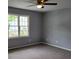 Spacious bedroom with neutral carpet, paint, and plenty of natural light from the windows at 136 Peachtree Memorial Nw Dr # Ga8, Atlanta, GA 30309