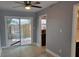 Bright dining area with sliding glass doors leading to the backyard and a view of the garden at 136 Peachtree Memorial Nw Dr # Ga8, Atlanta, GA 30309