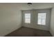 Bedroom with neutral walls, carpet and two windows at 36 S Auburn Landing Pl, Auburn, GA 30011