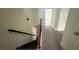 Hallway featuring soft carpet and natural light at 36 S Auburn Landing Pl, Auburn, GA 30011