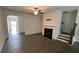 A cozy living room with modern fireplace and hardwood floors at 36 S Auburn Landing Pl, Auburn, GA 30011