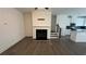 A well-lit living room with modern fireplace and hardwood floors at 36 S Auburn Landing Pl, Auburn, GA 30011