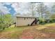 Exterior of home with a deck, sliding glass door and nice sized yard at 746 Polk Nw St, Marietta, GA 30064