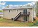 Back of home featuring a deck and patio area, perfect for entertaining outdoors at 746 Polk Nw St, Marietta, GA 30064