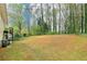 Expansive backyard featuring mature trees and plenty of room to enjoy the outdoors at 746 Polk Nw St, Marietta, GA 30064