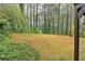 Large backyard featuring mature trees that enhance privacy and offer natural beauty at 746 Polk Nw St, Marietta, GA 30064