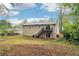 Exterior of home with deck, large sliding glass door, and good yard size at 746 Polk Nw St, Marietta, GA 30064