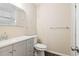 Bathroom with updated vanity, light gray cabinet, quartz countertop, and modern fixtures at 746 Polk Nw St, Marietta, GA 30064