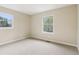 Bright bedroom featuring neutral walls, carpet, and natural light from the double-paned windows at 746 Polk Nw St, Marietta, GA 30064
