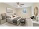Staged bedroom with a large bed, bench, lamps, and accessories at 746 Polk Nw St, Marietta, GA 30064