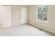 Bright bedroom featuring neutral walls and a view from the window at 746 Polk Nw St, Marietta, GA 30064