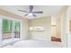 A carpeted bedroom with access to the deck and a glimpse of the kitchen at 746 Polk Nw St, Marietta, GA 30064