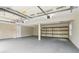 Spacious two-car garage with high ceilings, storage shelving, and ample room for vehicles at 746 Polk Nw St, Marietta, GA 30064