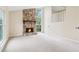 Inviting living room features a stone fireplace, high ceilings, and ample natural light from large windows at 746 Polk Nw St, Marietta, GA 30064