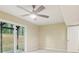 Bright living room features outdoor views, ceiling fan, sliding glass door to patio and a neutral color scheme at 746 Polk Nw St, Marietta, GA 30064