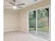 Bright living room with sliding doors opening to a scenic backyard. Includes ceiling fan at 746 Polk Nw St, Marietta, GA 30064