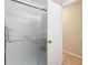 Bathroom shower enclosed with frosted glass door and neutral color walls at 746 Polk Nw St, Marietta, GA 30064