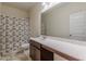 Bathroom featuring a vanity, a decorative shower curtain, and tile floors at 9061 Jim Purcell Dr, Covington, GA 30014