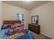 This bedroom has carpet floors, dresser and decor at 9061 Jim Purcell Dr, Covington, GA 30014