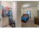Bedroom featuring carpet floor, decor, and closet at 9061 Jim Purcell Dr, Covington, GA 30014