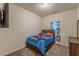 Neutral bedroom with carpet floors, dresser and decor at 9061 Jim Purcell Dr, Covington, GA 30014