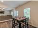 Dining area features stylish table setting, wood flooring and an outdoor view at 9061 Jim Purcell Dr, Covington, GA 30014