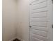 Interior view of a white paneled door and blank wall at 9061 Jim Purcell Dr, Covington, GA 30014