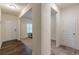 A home entryway featuring luxury vinyl plank flooring leading to a carpeted office at 9061 Jim Purcell Dr, Covington, GA 30014