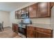 Kitchen features granite countertops, stainless appliances, and wood cabinets at 9061 Jim Purcell Dr, Covington, GA 30014
