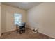 A bright office with a window, neutral carpet, and blank walls ready for decor at 9061 Jim Purcell Dr, Covington, GA 30014