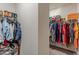 Walk-in closet with ample hanging space and shelving for organized storage at 9061 Jim Purcell Dr, Covington, GA 30014