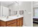 Bathroom featuring a double sink vanity at 1080 Treymont Ln, Lawrenceville, GA 30045
