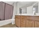 Bathroom featuring a shower and bathtub combination, vanity and sink at 1080 Treymont Ln, Lawrenceville, GA 30045