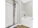 Bathroom features a tub and shower at 1080 Treymont Ln, Lawrenceville, GA 30045
