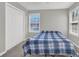 Bedroom featuring carpet floors, window and closet at 1080 Treymont Ln, Lawrenceville, GA 30045