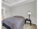 Bedroom with neutral walls next to ensuite bath at 1080 Treymont Ln, Lawrenceville, GA 30045